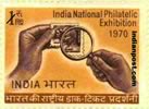 HANDS HOLDING MAGNIFYING GLASS ON STAMP 0629 Indian Post